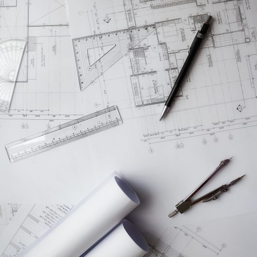 Image of engineering objects on workplace top view.Construction concept. Engineering tools.Vintage tone retro filter effect,soft focus(selective focus)